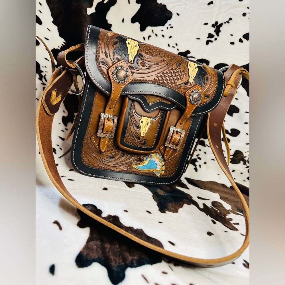 “Longhorn”                    This is a purse that is made from a saddle bag